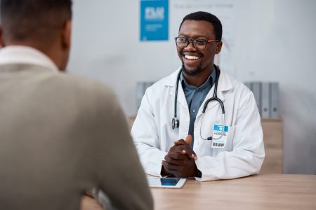 Black man doctor with patient in consultation office for healthcare advice, services and profession.