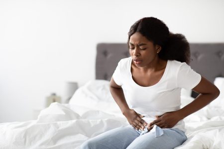 Young african american Woman obgyn concept. uterine fibroid pain